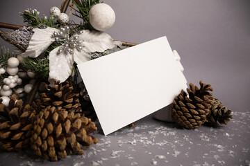 White sheet for Christmas wish message with winter fir tree branches and pine cones 