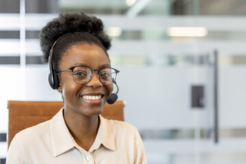 Young business woman with glasses and headset. Professional appearance in office setting. Emphasizes support, friendliness, communication. Ideal for business, customer service, and corporate imagery.