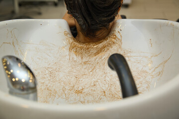 Rome, Italy - 10 31 2024 Dedicated station for washing hair with residual hair colorant in a women's beauty salon 