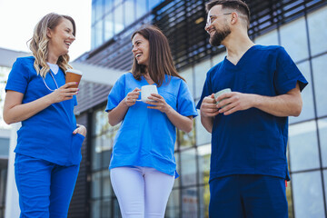 Healthcare Professionals Enjoying a Break with Coffee Outdoors