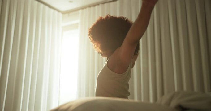 Girl, wake up and stretching in bedroom in home with morning routine or feeling fresh of sleeping. Woman, person or arm movement on bed for start day, energy or wellness of break, resting and sunrise