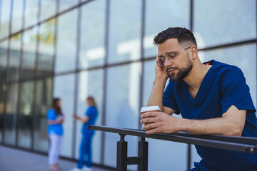 Exhausted Healthcare Worker Taking a Break Outside Hospital