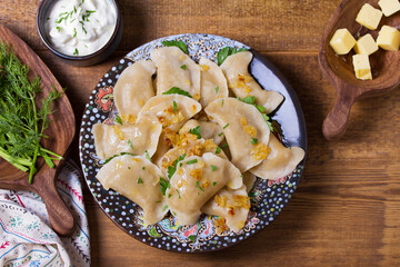 Dumplings filled with ground meat. Varenyky, vareniki, pierogi, pyrohy - dumplings with filling. View from above, top studio shot