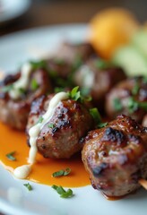 Juicy Glazed Meatballs with Creamy Sauce on Vibrant Orange Plate
