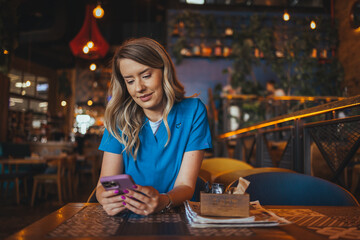 Young Woman Enjoying Coffee Break in Cozy Modern Cafe