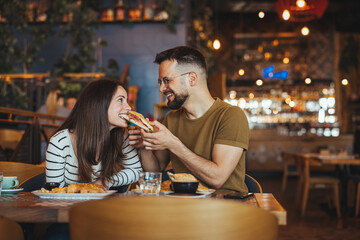 Happy Couple Enjoying Lunch Together at Cozy Cafe