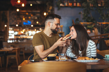 Happy Couple Enjoying a Meal Together at Cozy Restaurant