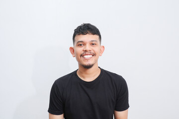 Fototapeta premium Young Adult Asian man smiling happy at the camera