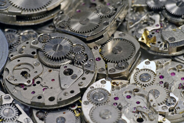 Old mechanical watches with gears and cogs. Watch or clock mechanisms