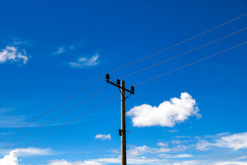 an electric pole in sunny weather