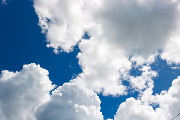 white clouds covering the blue sky