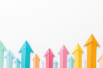Colorful paper airplanes arranged with upward pointing arrows