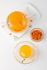 Sea buckthorn tea drink with oranges and mint. Autumn comfort hot drink. Herbal vitamin tea. 