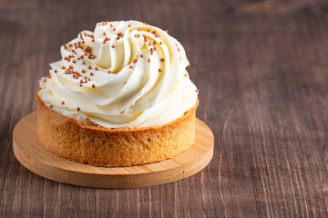 Lemon tartlets with whipped cream, sprinkles and chocolate chips on white background
