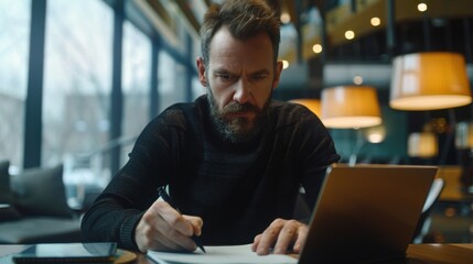 A focused freelancer writes notes at a coffee table, surrounded by a warm, cozy atmosphere with soft lighting and modern decor.
