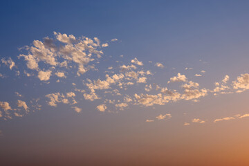 Beautiful sunset sky with pink clouds. Background or template.