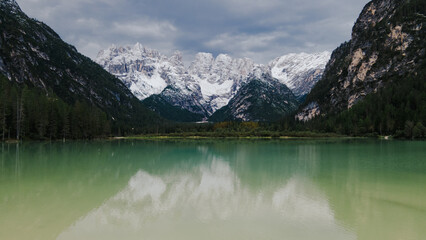 A beautiful lake placed between the Alps, a majestic landscape in the mountains.