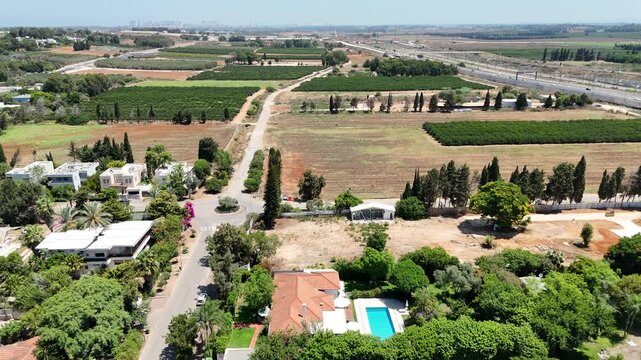 Aerial view over Rishpon moshav in Israel 
Rishpon is a moshav in the Central District of Israel, 2024
