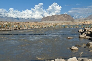 Bridge over Indus river in Skardu city and Karakoram mountain range. Gilgit-Baltistan region. Pakistan. Asia.