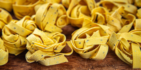 tagliatelle with chia seeds raw pasta vegetable dish Fresh delicious gourmet food background On the...