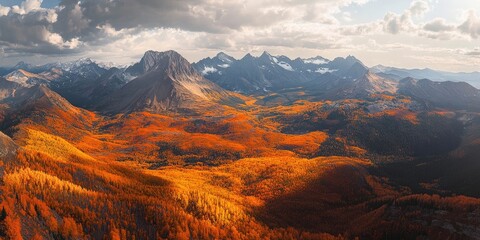 Naklejka premium A stunning aerial perspective showcases mountains adorned with bright orange leaves, highlighting the vivid colors of fall foliage in a breathtaking landscape.