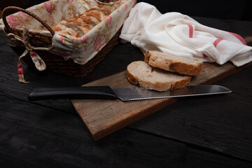 Rustic Bread Display with Sliced Whole Grain Loaf in Wicker Basket on Wooden Table - Perfect for Bakery, Culinary, and Farmhouse Decor Themes