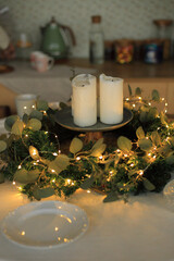 This enchanting Christmas table setting captures the warmth and joy of the holiday season. Adorned with twinkling fairy lights, elegant dinnerware, and seasonal decorations, the table is a perfect