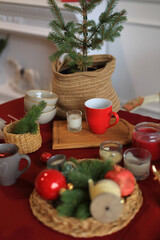 This enchanting Christmas table setting captures the warmth and joy of the holiday season. Adorned with twinkling fairy lights, elegant dinnerware, and seasonal decorations, the table is a perfect
