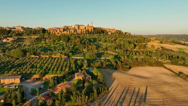 Beautiful autumn countryside sunset in Tuscany, Pienza, Italy. Aerial view.