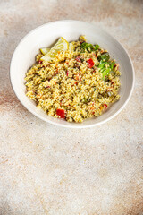 tabbouleh bulgur couscous with vegetables dish fresh delicious vegetarian and vegan food gourmet food background on the table rustic food top view copy space keto and paleo diet