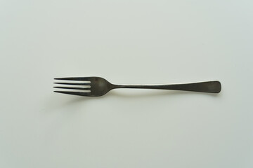 Top view of fork against white background. Photo taken November 4th, 2024, Zurich, Switzerland.