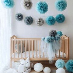 Obraz premium Tulle pompoms in blue and gray hang on crib