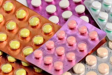 Colorful assortment of pharmaceutical pills in blister packs
