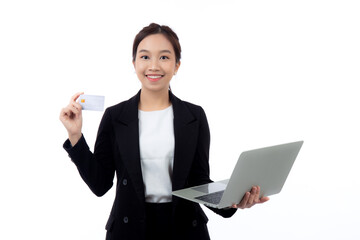 Portrait young asian businesswoman holding credit card and laptop for shopping online and payment isolated white background, business woman paying debit card or doing transaction with finance.