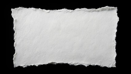 Torn white paper square on black background