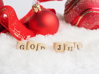 Red Vintage Christmas baubles with wooden blocks and the words God Jul