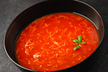 Tomato soup with vermicelli gazpacho first course dish fresh delicious gourmet food background on the table rustic food top view copy space keto and paleo diet Vegetarian and vegan food