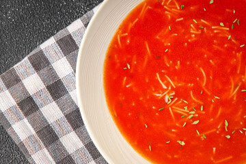 Tomato soup with vermicelli gazpacho first course dish fresh delicious gourmet food background on the table rustic food top view copy space keto and paleo diet Vegetarian and vegan food
