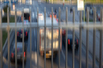 Blurred motion of cars on the motorway. Big traffic in the city. Urban highway filled out cars. Rush hours. Top view. Front and back view of traffic.

