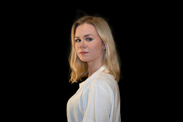 Portrait of a young woman in profile with a contemplative expression