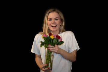 Radiant and Happy Blonde Woman Smelling Roses