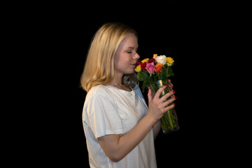 Joyful Blonde Woman Scenting Fresh Roses