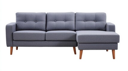 Fototapeta premium A stylish modern gray sectional sofa with tufted cushions and wooden legs, perfect for any contemporary living space.