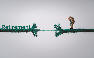 Couple Senior Pensioners standing on rope which it breaking for risk of financial planning ,money saving and life insurance of retirement concept.