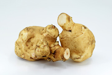 Jerusalem artichoke (Helianthus tuberosus) tubers on white background
