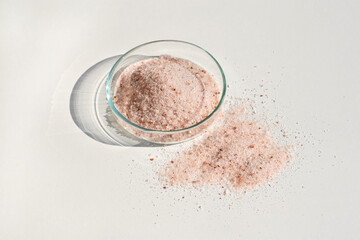 Himalayan salt in a petri dish and around 