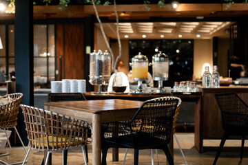Cozy Modern Cafe Interior With Stylish Wooden Furniture and Blurry Background for wallpaper