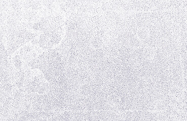 Light background with dark dots and spots on the surface