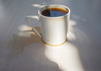 Spilled coffee cup stain on wooden floor	