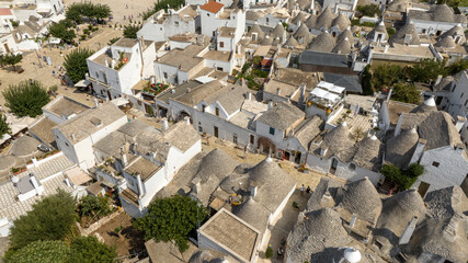 Aerial view of a street among the trulli of Alberobello, in the metropolitan city of Bari in...